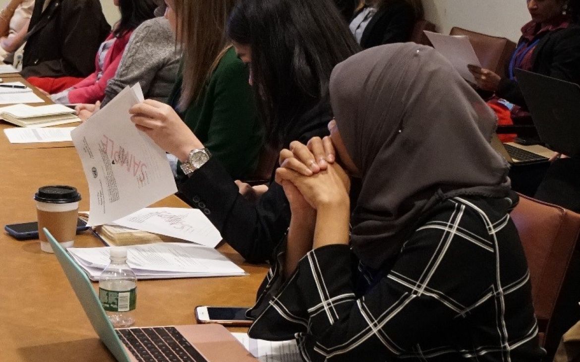 Delegates examining sample ballots