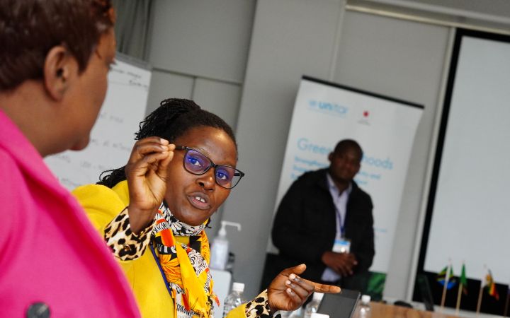 Angelamercy Baltazary working with other participants.