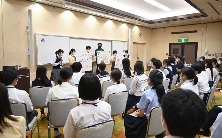 Koua's group presented in front of the panel and fellow Youth Ambassadors