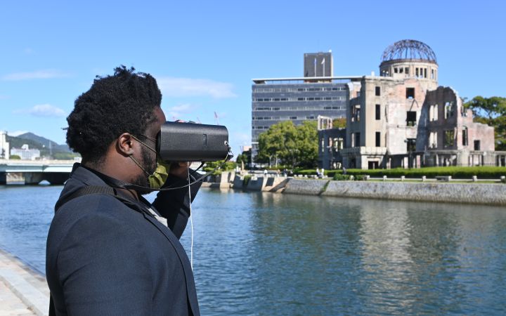 UNITAR staff using virtual reality goggles for the VR Tour around the Peace Memorial Park in Hiroshima
