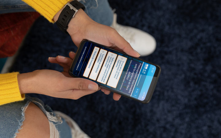Person leaning over phone