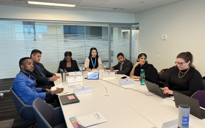 The PGA Fellows sitting in a conference room during a session