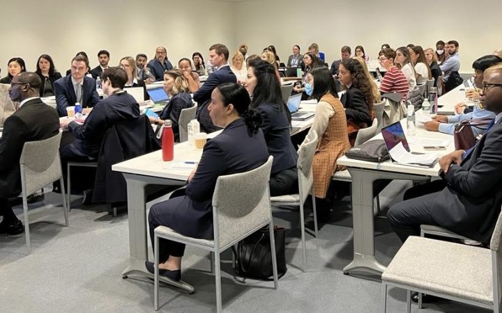 Delegates listening to Columbia presenters