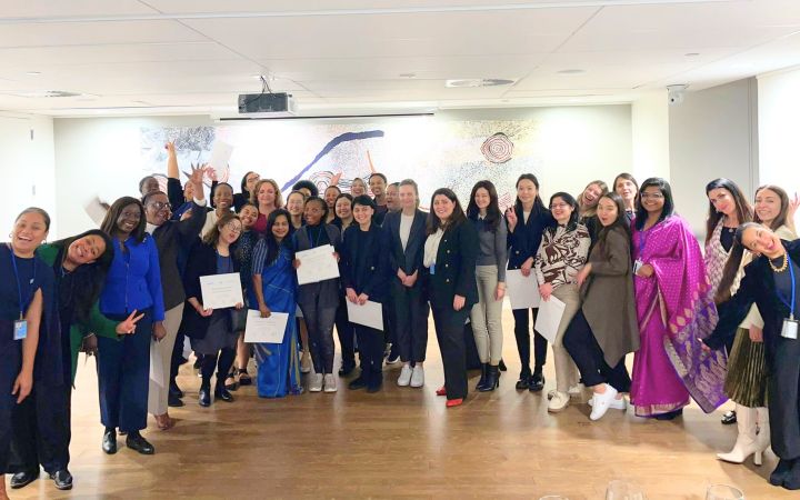 Group of fellows gather for picture to celebrate successful conclusion of project