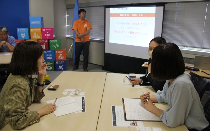 UNITAR Association members discussing together