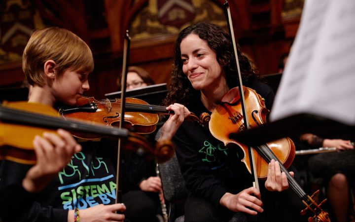 Music students playing the violin