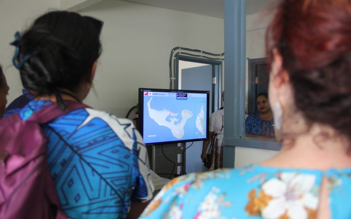 Training program participants learning about disaster detecting system.