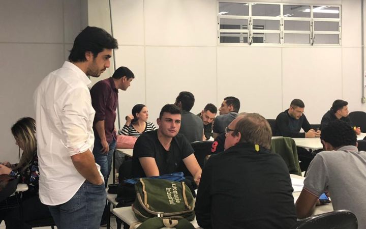 A group of students discussing SDG 9, innovation and industry