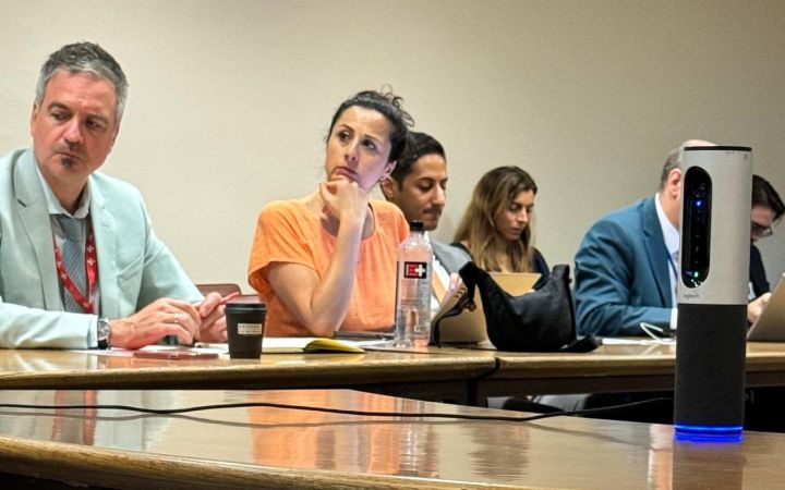 Photo of participants listening intently to the speakers