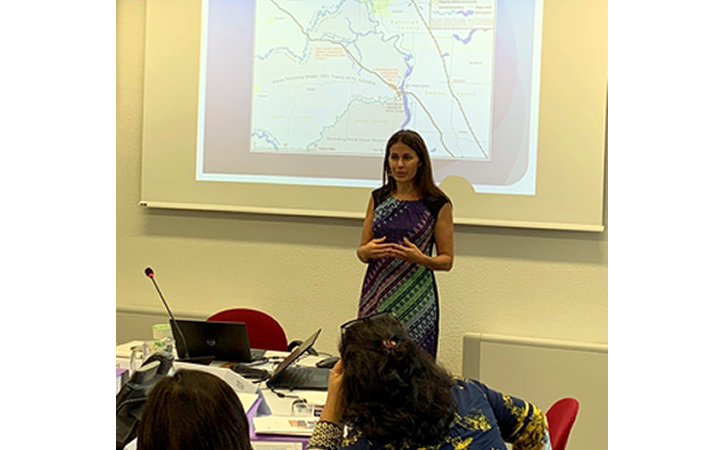 Prof. Kristen Carpenter, Chair of EMRIP presents