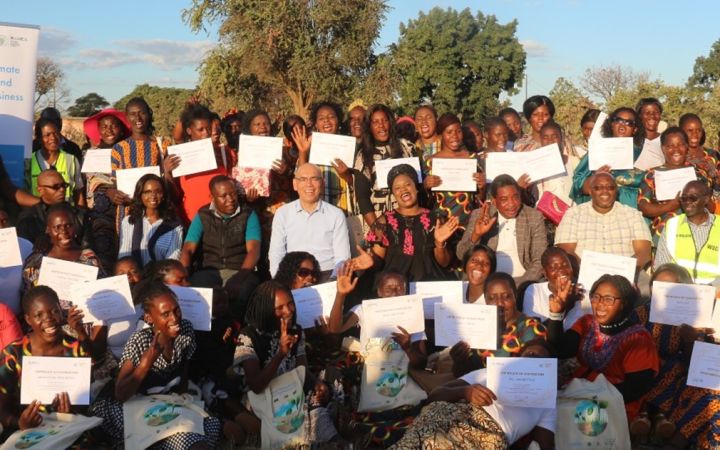 Women farmers and community leaders in Shantumbu, Zambia poses for a photo after receiving their certificates of completion.