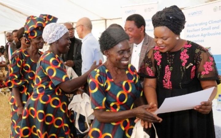 Dr Buumba Malambo- Mayor Kafue Town, Zambia presents certificate to women farmers who benefited from the programme in Shantumbu