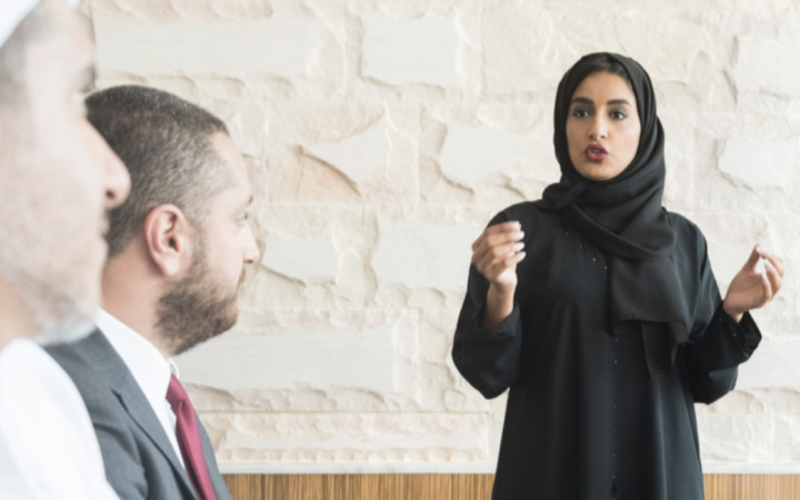 Woman speaking at a meeting.