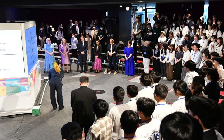 Youth Symposium on Peace attendees sing "Lean on Me" to conclude the session.