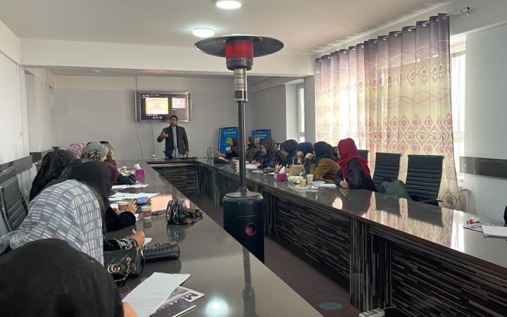 Afghan women seated in a room for the entrepreneruship training programme