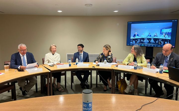 Panelists seated around the table