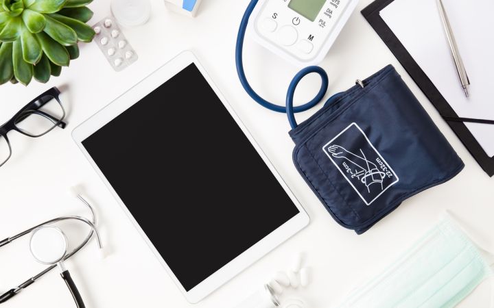 Digital tablet and blood pressure monitor, via Envato Elements