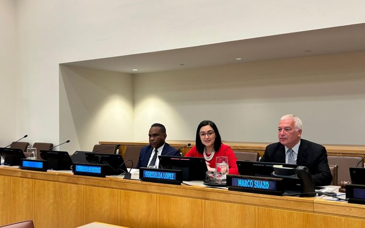 H.E. Egriselda Lopez, H.E. Marco Suazo, and Mr. Lionelito Berridge on the podium during the session