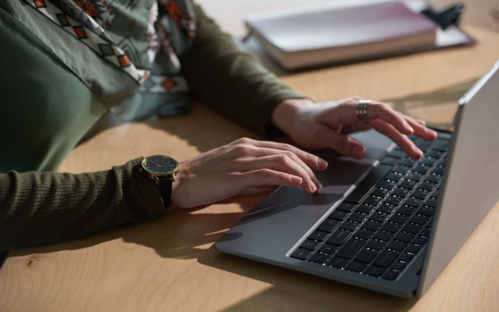 Woman typing on a laptop