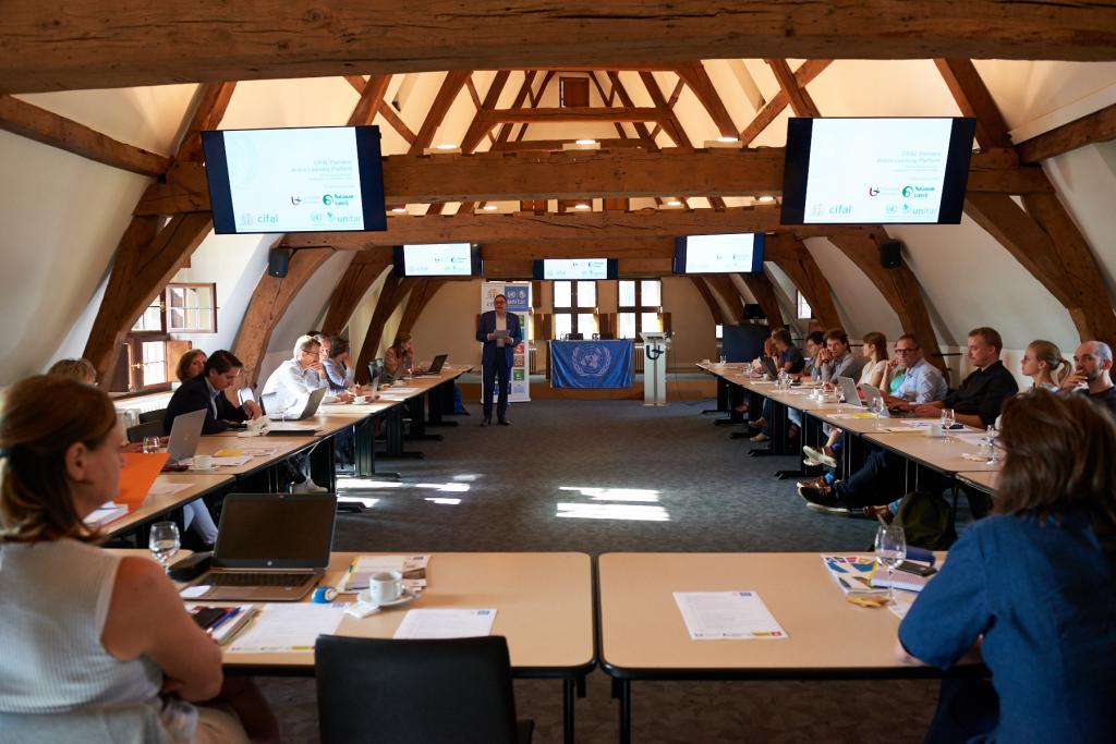 Speaker discussing the importance of the implementation of SDGs