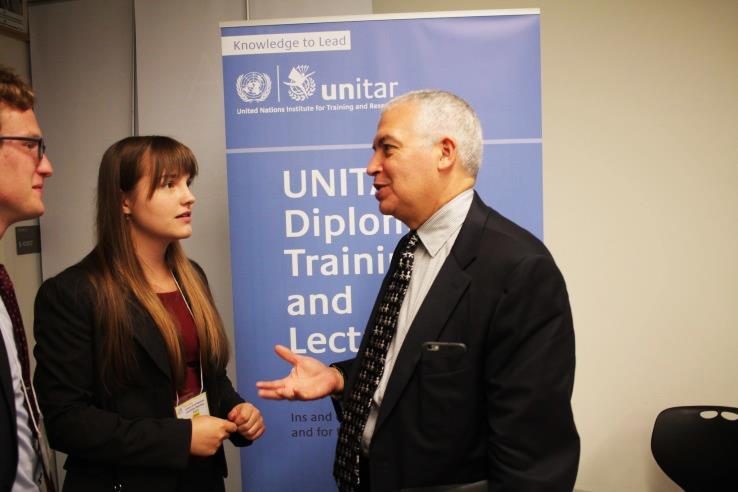 Mr. Suazo discussing with students