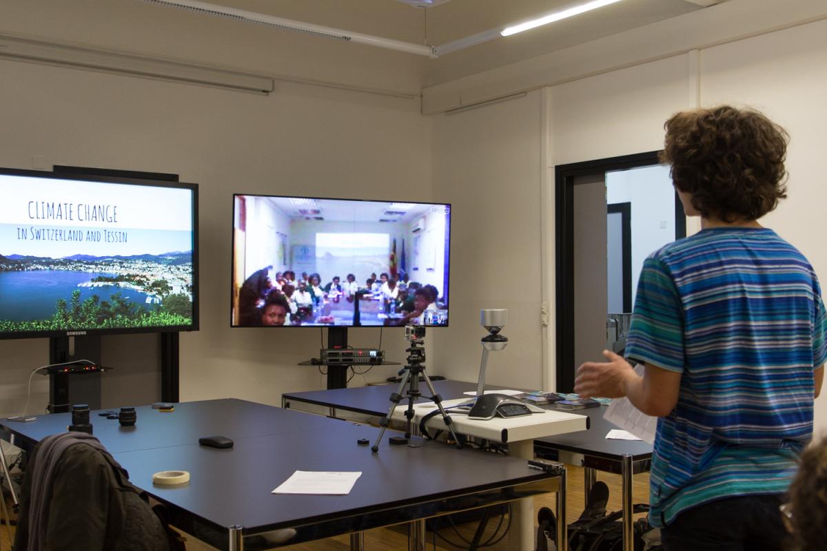 Students at at Liceo Cantonale di Lugano 1 in Switzerland exchange their experience of climate change with pupils at Gayaza High School in Uganda (Photo: UNITAR)